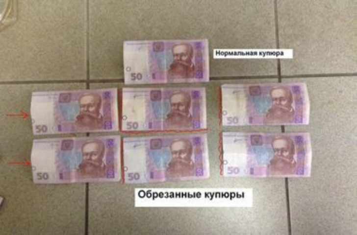 В обменниках киевлянам подсовывают деньги с обрезанными краями