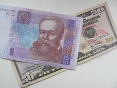C чем связано ослабление гривны